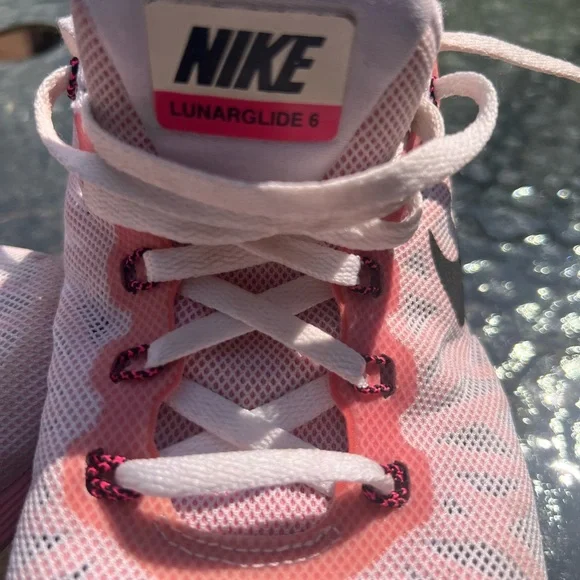 Nike Women's Pink, White and Black athletic sneakers. - Picture 7 of 17